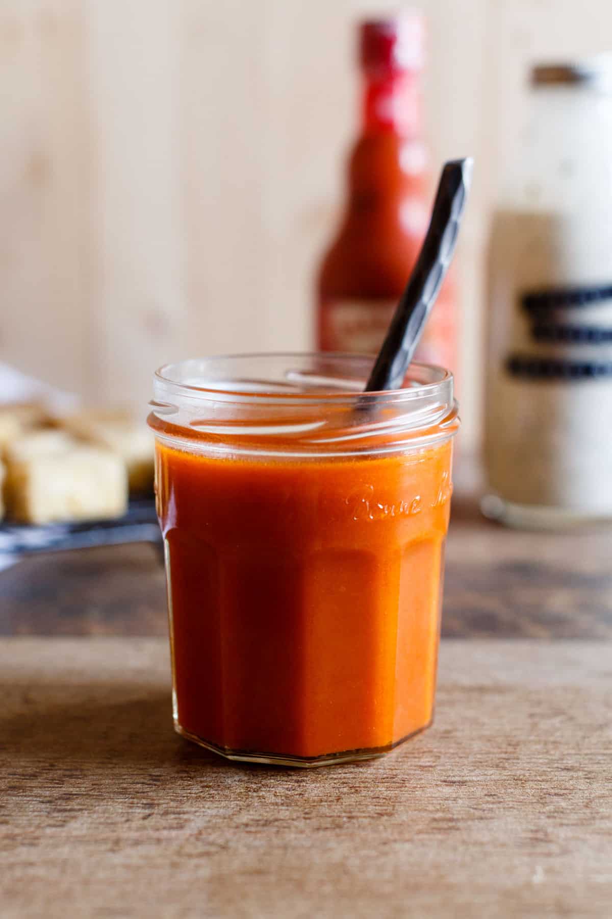Jar of homemade Vegan Spicy Buffalo Sauce.