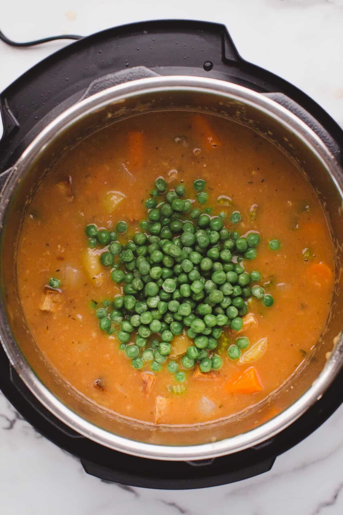 Peas added to Instant Pot Vegan Tofu & Little Potato Stew.