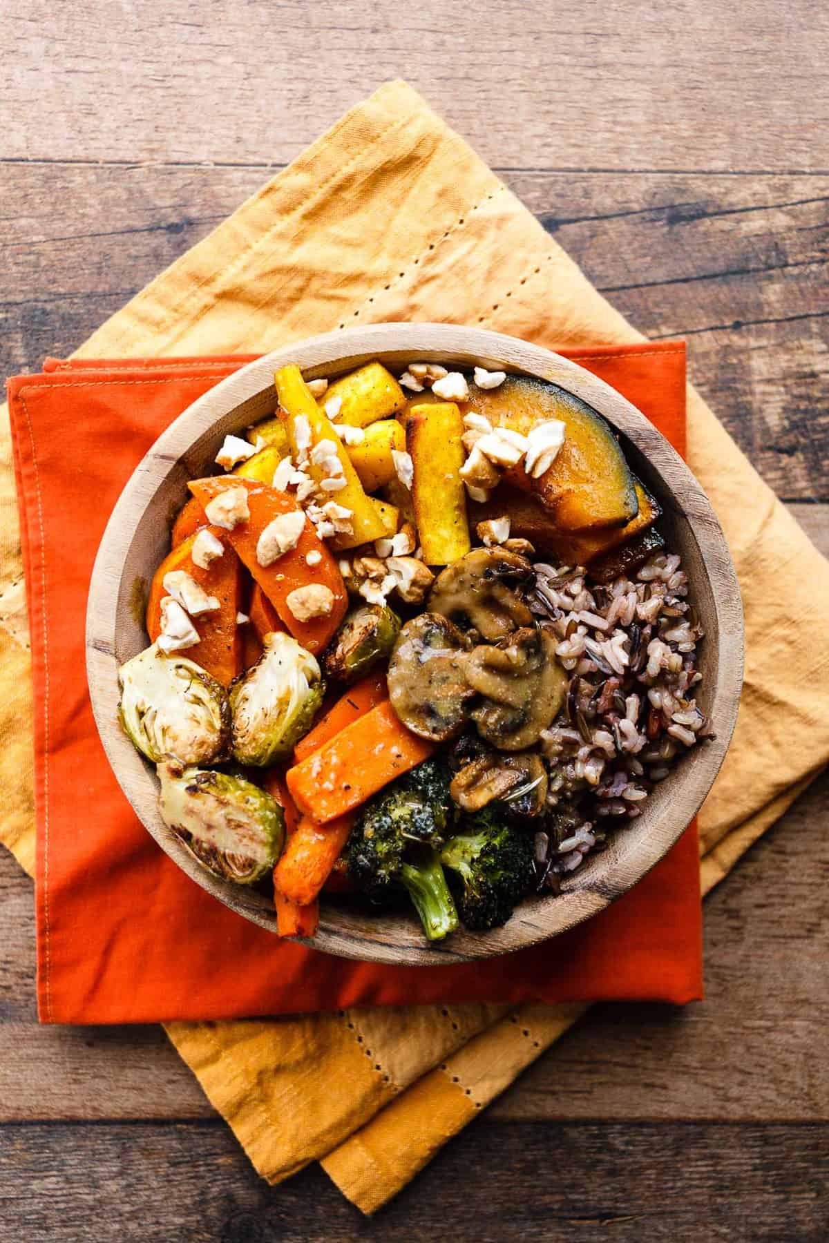 Roasted Fall Vegetable Bowl on a wood background.