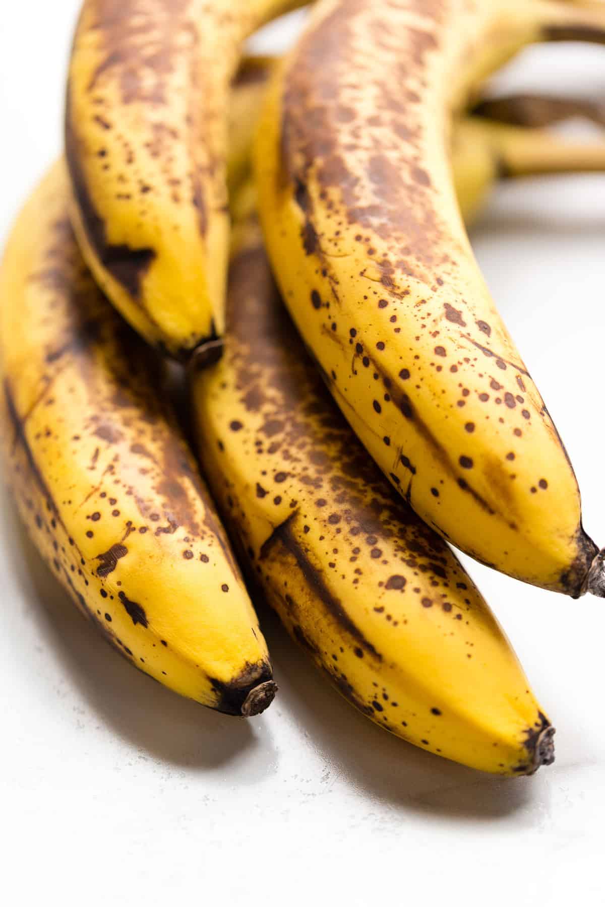 Heavily speckled over ripe bananas for making vegan banana bread.