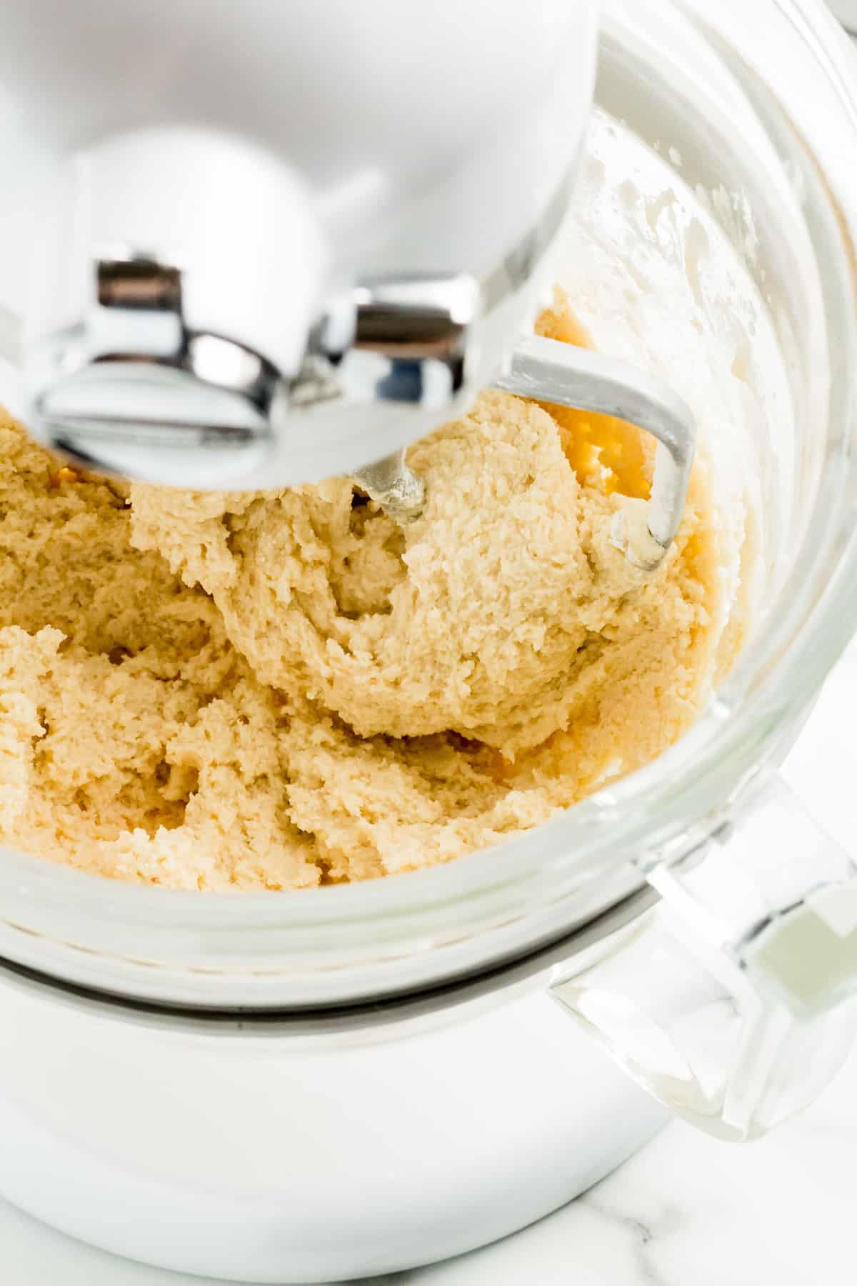 Vegan butter cookie dough in a stand mixer.
