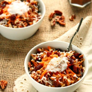 Spiced Carrot Cake Oatmeal with Coconut Cream {naturally sweetened!} via ilovevegan.com - A delectable dessert-worthy breakfast that's super simple and ready in under 15 minutes! Healthy eating staples are taken to a whole new level in this delicious breakfast. Think plump juicy raisins, crunchy pecans, flaked coconut, and traditional Fall spices like cinnamon and ginger - all naturally sweetened with soft caramel-y dates and real maple syrup. The perfect warming breakfast for a chilly Autumn morning! #vegan #glutenfree #soyfree #naturallysweetened #oatmeal